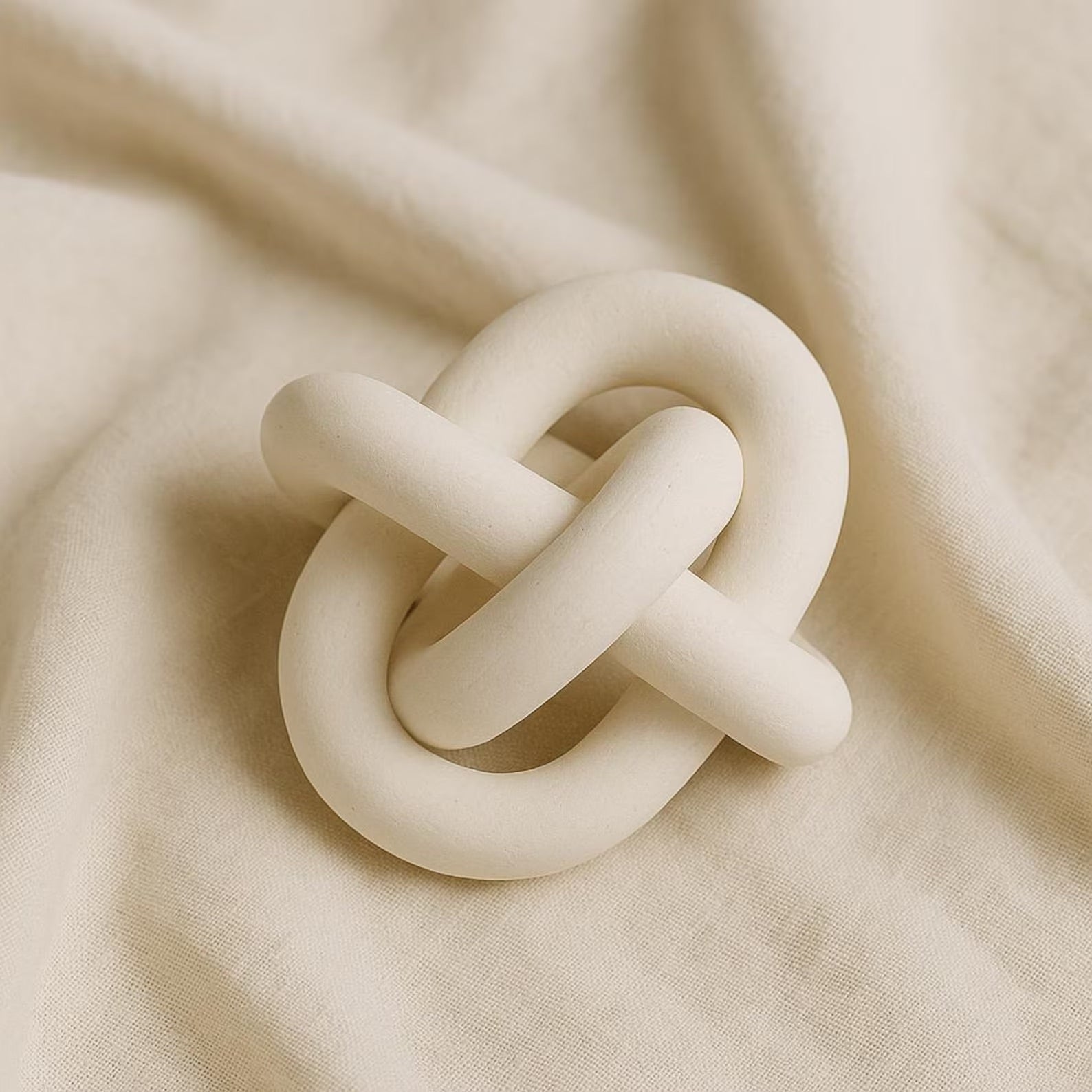 Minimalist walnut wood ring sculpture with triple circle design for modern home décor
